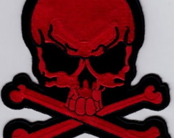 May include: Red skull and crossbones patch with black outline. The patch measures 5.75 inches by 5 inches.