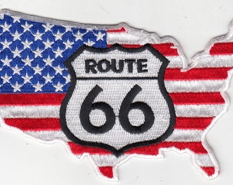 May include: A white and red embroidered patch shaped like the United States of America with a black and white Route 66 sign in the center.