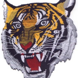 May include: A close-up of a tiger's face with a fierce expression. The tiger is depicted in a black, white, yellow, and red embroidered patch. The patch measures 4.5 inches by 3.9 inches.
