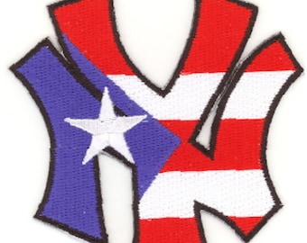 May include: Embroidered patch featuring a stylized "NY" logo, incorporating the Puerto Rican flag. The design includes a blue section with a white star and red and white stripes, with black outlining.