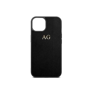 May include: Black phone case with a textured finish and gold initials "AG" in the centre.
