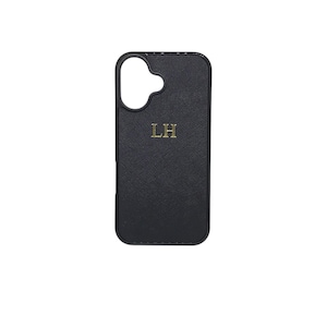 May include: Black phone case with a gold monogram "LH" on the back.