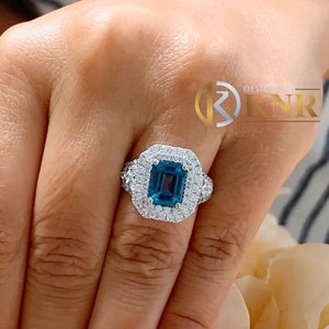Emerald Cut Natural London Blue Topaz And Round, Marquise, Princess Cut Side Simulated Diamonds Engagement Ring 14K Solid White Gold 3.50ctw