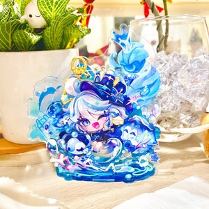 May include: A blue and white anime character figurine with a crown and a blue and white background. The figurine is made of clear acrylic and has a 3D effect.