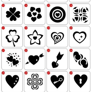 May include: A sheet of 32 black and white stencils for creating heart-themed designs. The stencils are numbered 9 through 32 and feature various heart shapes, including interlocking hearts, hearts with arrows, and hearts with stars.