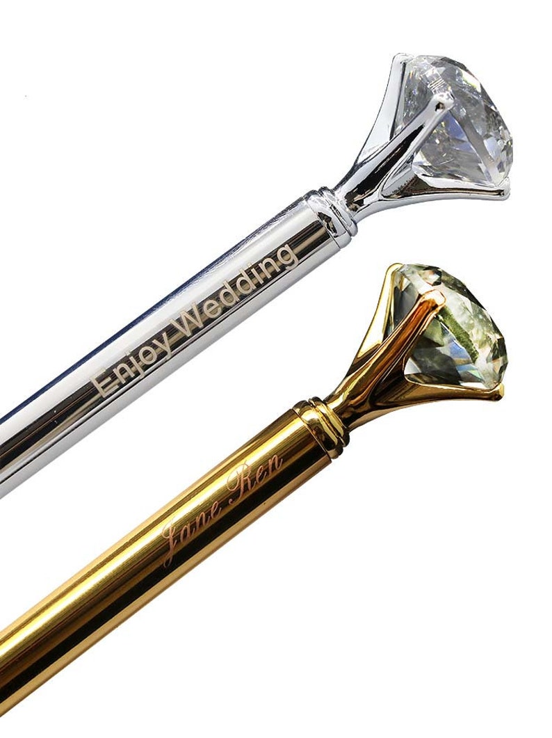 May include: Two diamond ring pens, one silver with the inscription "Enjoy Wedding" and one gold with the inscription "Jane Ren".