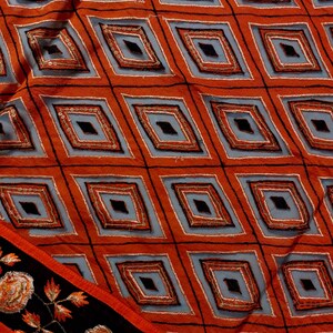 Add a touch of elegance to your ethnic wardrobe with this stunning handmade dupatta, crafted by skilled artisans from India. This exquisite piece showcases a bold diamond pattern.