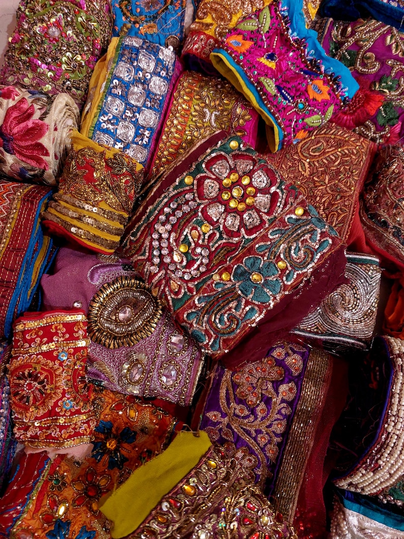 Discover a stunning assortment of vintage Indian saree trims with this wholesale lot! Each piece features rich embroidery, sequins, beads, and zari work, making it perfect for DIY projects, fashion, and home décor.
Each bag includes a minimum of 10, 15, or 25 beautifully embroidered fabric pieces, perfect for embellishments, crafts, collage, ribbons, and border trims.
This one-of-a-kind mix of handcrafted trims is perfect for crafters, designers, and creative minds.