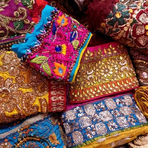 Discover a stunning assortment of vintage Indian saree trims with this wholesale lot! Each piece features rich embroidery, sequins, beads, and zari work, making it perfect for DIY projects, fashion, and home décor.
Each bag includes a minimum of 10, 15, or 25 beautifully embroidered fabric pieces, perfect for embellishments, crafts, collage, ribbons, and border trims.
This one-of-a-kind mix of handcrafted trims is perfect for crafters, designers, and creative minds.