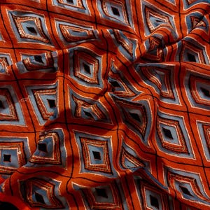 Add a touch of elegance to your ethnic wardrobe with this stunning handmade dupatta, crafted by skilled artisans from India. This exquisite piece showcases a bold diamond pattern.