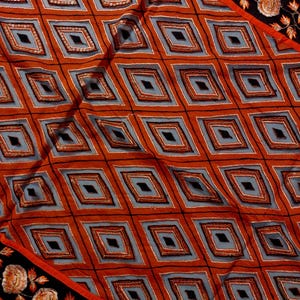 Add a touch of elegance to your ethnic wardrobe with this stunning handmade dupatta, crafted by skilled artisans from India. This exquisite piece showcases a bold diamond pattern.