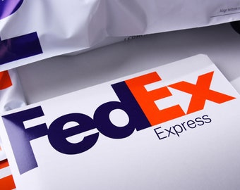 May include: A white FedEx Express envelope with the FedEx logo in blue and orange.