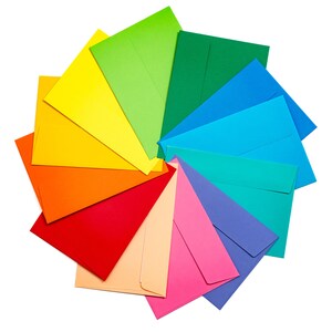 May include: A rainbow of colorful envelopes arranged in a circle, with the colors transitioning from red to orange, yellow, green, blue, and purple.