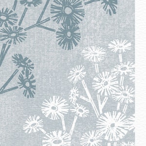May include: A blue and white floral print with a textured background. The flowers are stylized and resemble dandelions. The print is signed "A. Pagnes".