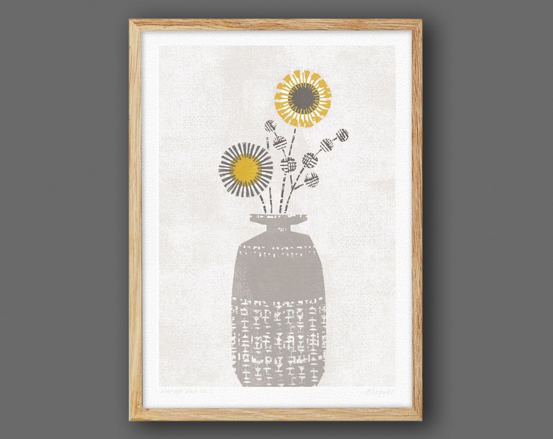 May include: A gray vase with a textured pattern holds a bouquet of yellow and gray flowers. The flowers have a simple, geometric design.