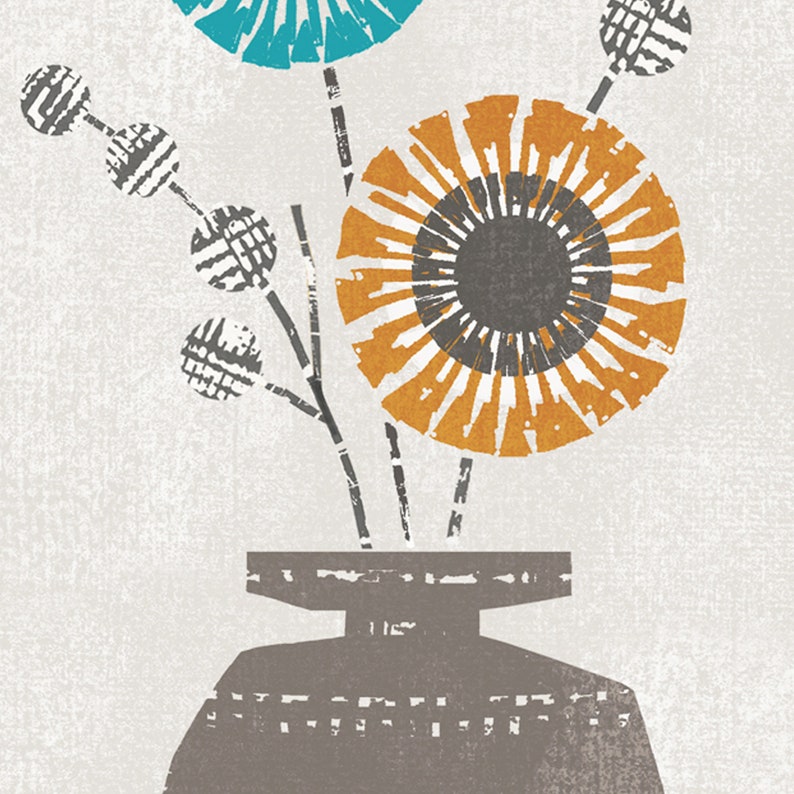May include: A gray ceramic vase with a wide mouth holds a bouquet of stylized flowers. The flowers are in shades of teal, orange, and gray. The vase has a textured surface.