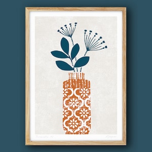 May include: A brown vase with a white geometric pattern, filled with blue stylised flowers. The vase is on a white background with the text "Terracotta No. 1" and "Harper" in the bottom corners.