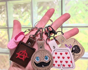 Dungeon Crawler Carl-inspired keychains