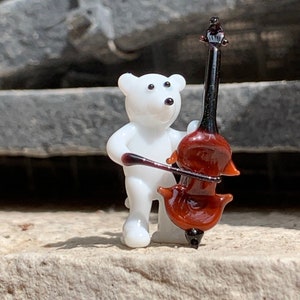 White or brown bear playing the bass, Murano glass double bassist lampworked in Venice. See all the orchestra players and musicians