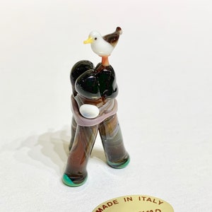 Seagull in the Venetian Lagoon, on the Bricole, typical wodden poles of Venice. Murano glass figurine souvenir by Umberto Ragazzi.