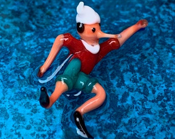 Pinocchio swimming, Murano glass figure lampworked in Venice by Umberto Ragazzi, see my miniatures and statuettes