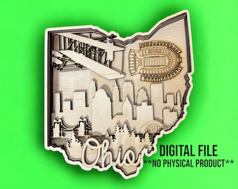 May include: A laser cut wooden design of the state of Ohio with a skyline of Cleveland, a football stadium, and an airplane. The word "Ohio" is written in a decorative font at the bottom of the design. The text "DIGITAL FILE **NO PHYSICAL PRODUCT**" is written at the bottom of the image.