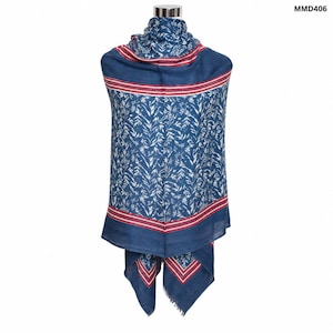 May include: A blue scarf featuring a white botanical leaf pattern, accented by horizontal red and white striped borders. The scarf displays the text MMD406 in the upper right corner. The fabric has a soft texture and drapes over a mannequin.