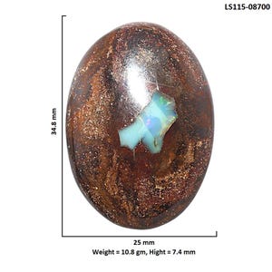 May include: An oval-shaped boulder opal cabochon with a dark brown, ironstone matrix featuring swirling metallic copper and bronze inclusions. A bright, iridescent blue-green opal vein is centered. Text reads LS115-08700, 34.8 mm, 25 mm, 10.8 gm, 7.4 mm.