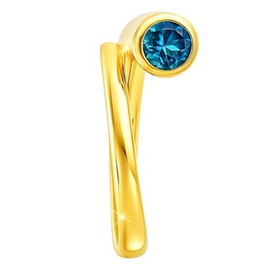 May include: A gold-colored ring with a twisted band design. The ring features a round, faceted, teal-colored gemstone set in a bezel setting. The ring is set against a white background.