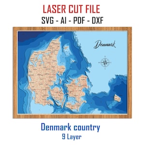 May include: A laser cut file of a 9-layer 3D map of Denmark. The map is in a wooden frame and shows the country's coastline, islands, and major roads. The text "Denmark" is written in cursive at the top of the map. The text "Denmark country 9 Layer" is written below the map.