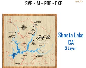 May include: Wooden laser-cut map of Shasta Lake, California, with blue water detail and red roads. Includes text: "Shasta Lake CA 9 Layer" and "LASER CUT FILE SVG - AI - PDF - DXF". The lake's surface area is 29,500 acres, with a max depth of 517 ft.