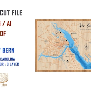 May include: A laser cut file of a map of New Bern, North Carolina. The map is on a wooden background and shows the city's streets, waterways, and landmarks. The file is available in SVG, AI, and PDF formats. The text "New Bern, North Carolina" is visible at the top of the map.