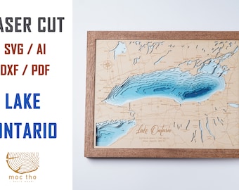 Puede incluir: Mapa de madera de Lake Ontario cortado con láser con contornos de profundidad de agua azules. El mapa está enmarcado en un marco de madera marrón. El texto "Lake Ontario" está impreso en el mapa. El texto "Superficie: 7.340 millas cuadradas. Profundidad máxima: 802 pies" está impreso debajo del nombre del lago.