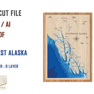 May include: Laser cut file of a map of Southeast Alaska. The map is in a wooden frame and has a blue and white color scheme. The file is available in SVG, AI, and PDF formats. The file vector is 9 layers.