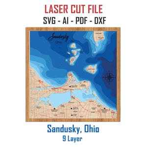 May include: A wooden framed, multi-layered map of Sandusky, Ohio, with blue water depth contours. The map includes the text "Sandusky, Ohio" and "9 Layer". The top text reads "LASER CUT FILE SVG - AI - PDF - DXF".