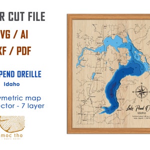 May include: Wooden framed laser-cut map of Lake Pend Oreille, Idaho, with blue water depth layers. The map includes a compass rose and text that reads "Lake Pend Oreille, Idaho". The image also includes the text "LASER CUT FILE" and "SVG / AI, DXF / PDF".