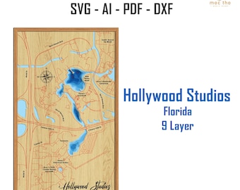 May include: A wooden laser-cut map of Hollywood Studios in Florida, featuring a detailed 9-layer design. The map includes roads, water features, and landmarks, with the text "Hollywood Studios Florida 9 Layer" and "LASER CUT FILE SVG - AI - PDF - DXF".