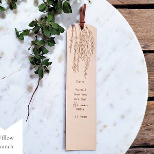 The Willow Tree design.  You can request a name or up to a couple words at the beginning of this note: You will never need more than He can supply.  -J.I. Packer.  This bookmark is neutral in color and has a very simple and minimalist style.