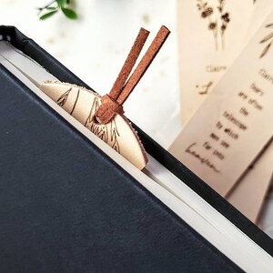 Each bookmark has a medium brown suede tassel at the top.  It holds its shape and won't get in the way of the pages.  The bookmarks are made from a thin vegetable tanned leather.  They are a nude color and have not been dyed.  6.75 inches long.
