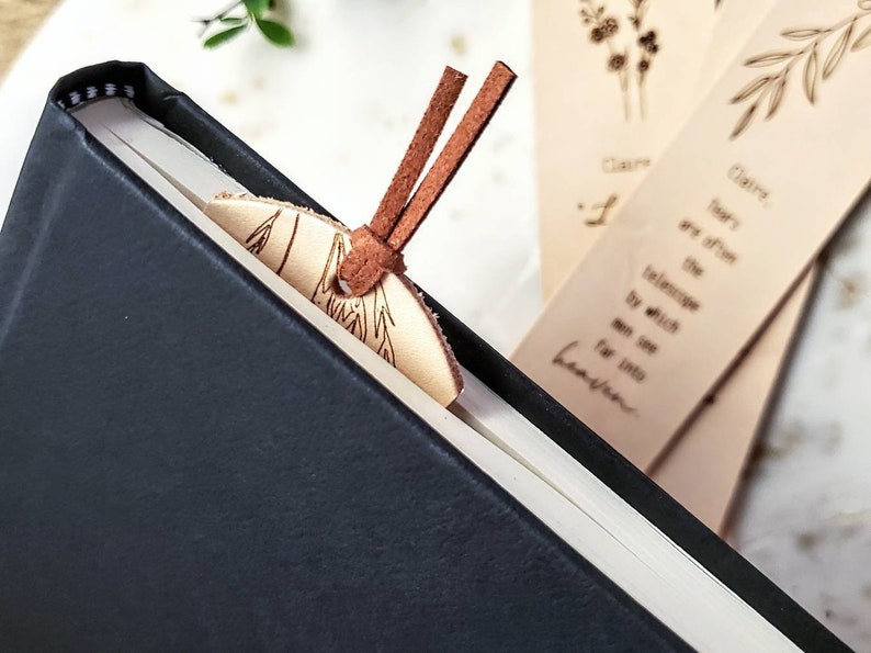 Each bookmark has a medium brown suede tassel at the top.  It holds its shape and won't get in the way of the pages.  The bookmarks are made from a thin vegetable tanned leather.  They are a nude color and have not been dyed.  6.75 inches long.