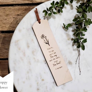 The Poppy Flower design.  You can request a name or up to a couple words at the beginning of this note: If you can't see His way past the tears, trust His heart. -C. Spurgeon.  This bookmark is neutral in color and has a simple, minimalist style.