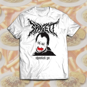 May include: White t-shirt with a black and red graphic design. The design features the word "SPAGETT" in a dripping, gothic font above a black and white illustration of a person with red lips. The text "spooked ya" is below the illustration.
