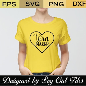 May include: A yellow t-shirt with a black heart design that says "twin maker" inside the heart.