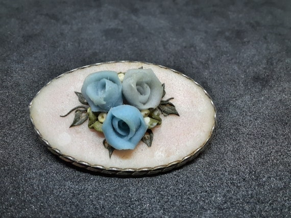 Vintage carved brooch made of blue roses stone