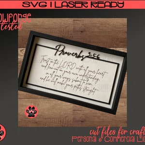 May include: A framed wooden sign with the text "Proverbs 3:5-6" and the quote "Trust in the LORD with all your heart and lean not on your own understanding..." in a black frame. The sign is designed for crafters and is laser-ready.