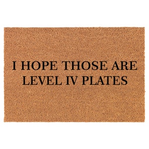 May include: A brown doormat with the text "I hope those are level IV plates" in black.