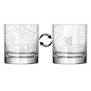 May include: Two clear glass tumblers with a map of the University of Southern California etched on the front and the letters "USC" etched on the back.