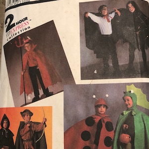 May include: Simplicity Costumes pattern for making children's Halloween costumes. The pattern includes instructions for making a devil, a ladybug, a Robin Hood, and a vampire costume. The pattern is for sizes small to large.