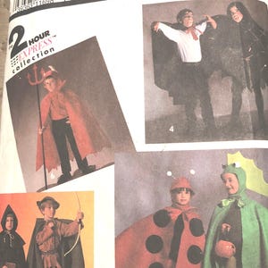 May include: A Simplicity Costumes sewing pattern envelope, number 7470, size A (SM-LG). The white paper package features illustrations of various children's costumes, including a devil, a vampire, a forest archer, a ladybug, and a frog, with text.