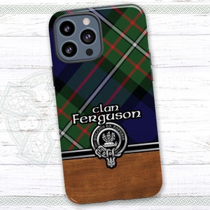 May include: A blue, green, and red tartan phone case with a silver clan crest and the text "Clan Ferguson" in white. The case has a wood-grain pattern on the bottom.